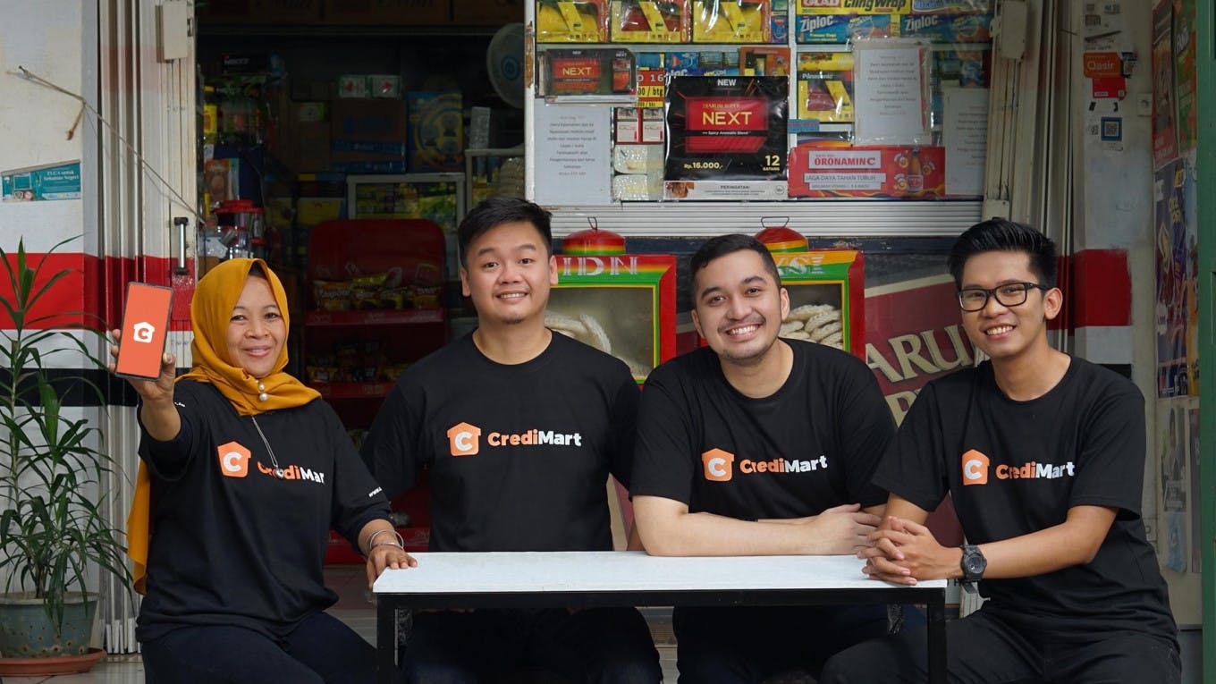 CrediBook's founders with CrediMart customer (left). The start up recently closed its $8.1M Series A funding. (Courtesy of CrediBook)